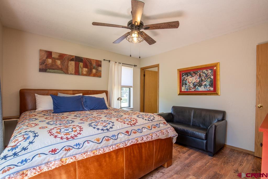 128 Hermosa Circle Durango, CO 81301 - Photo 17 of 26 a bedroom with a large bed and a couch