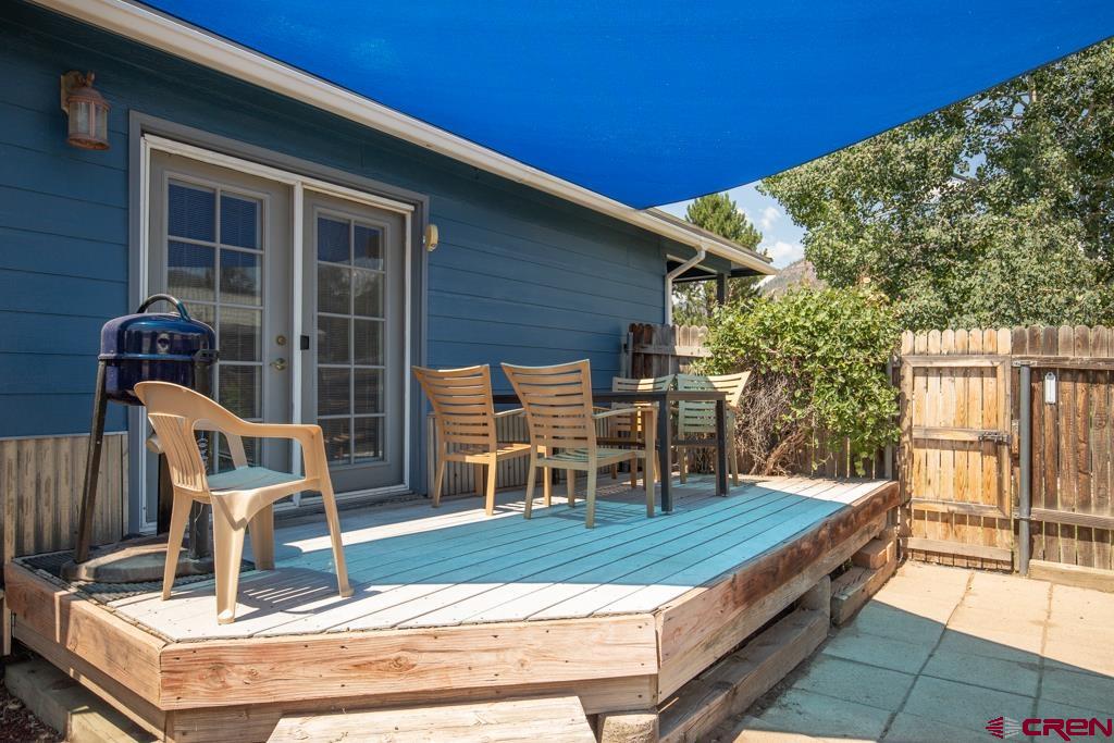 128 Hermosa Circle Durango, CO 81301 - Photo 2 of 26 a backyard of a house with seating space