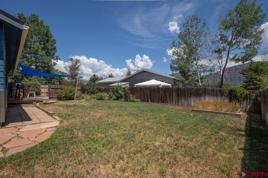 128 Hermosa Circle Durango, CO 81301 - Photo 3 of 26 a backyard of a house with lots of green space
