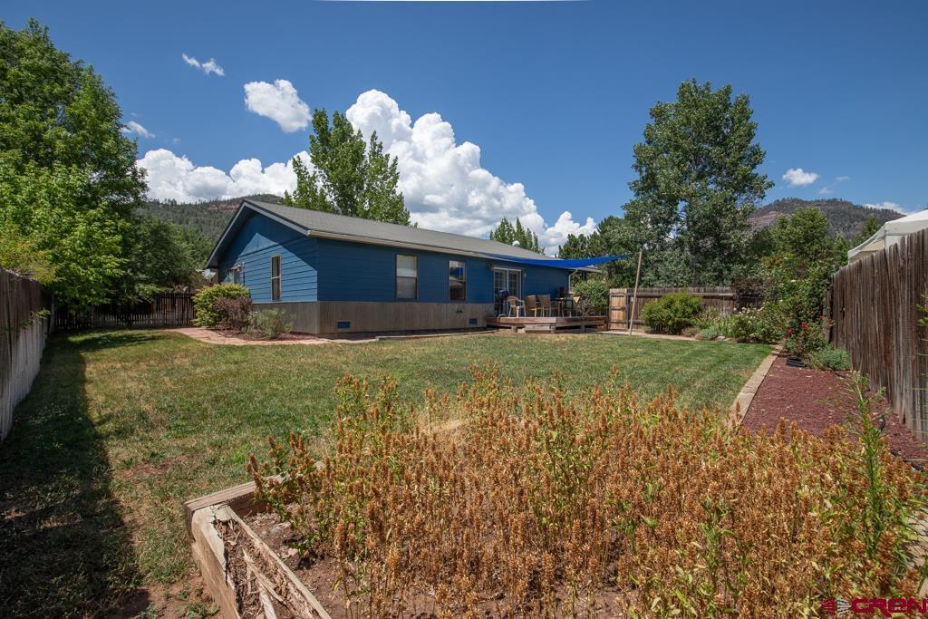 128 Hermosa Circle Durango, CO 81301 - Photo 4 of 26 a view of a house with a yard
