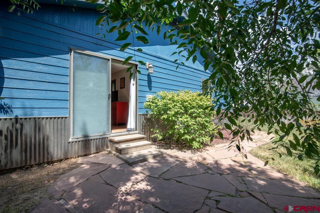 128 Hermosa Circle Durango, CO 81301 - Photo 6 of 26 a front view of a house with garden