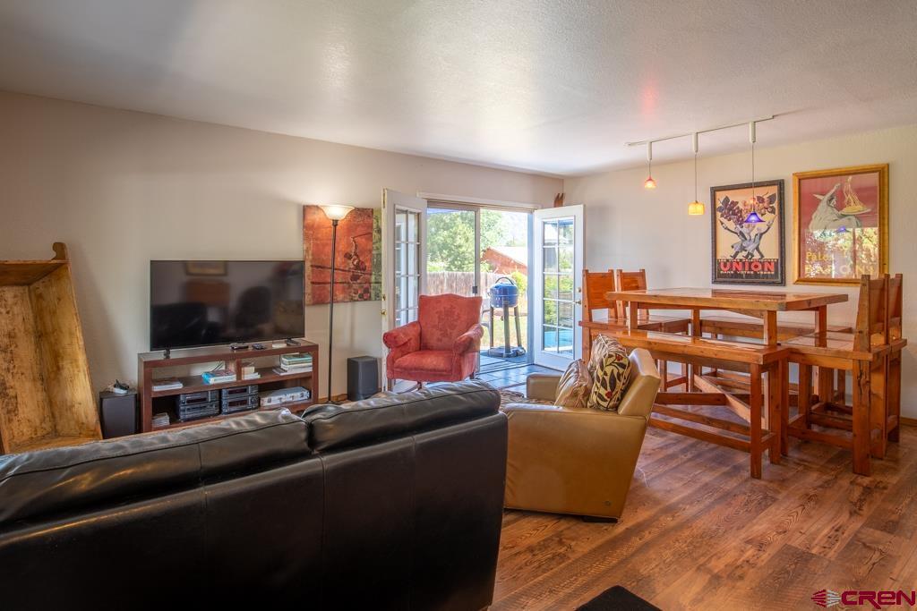 128 Hermosa Circle Durango, CO 81301 - Photo 7 of 26 a living room with furniture and a flat screen tv
