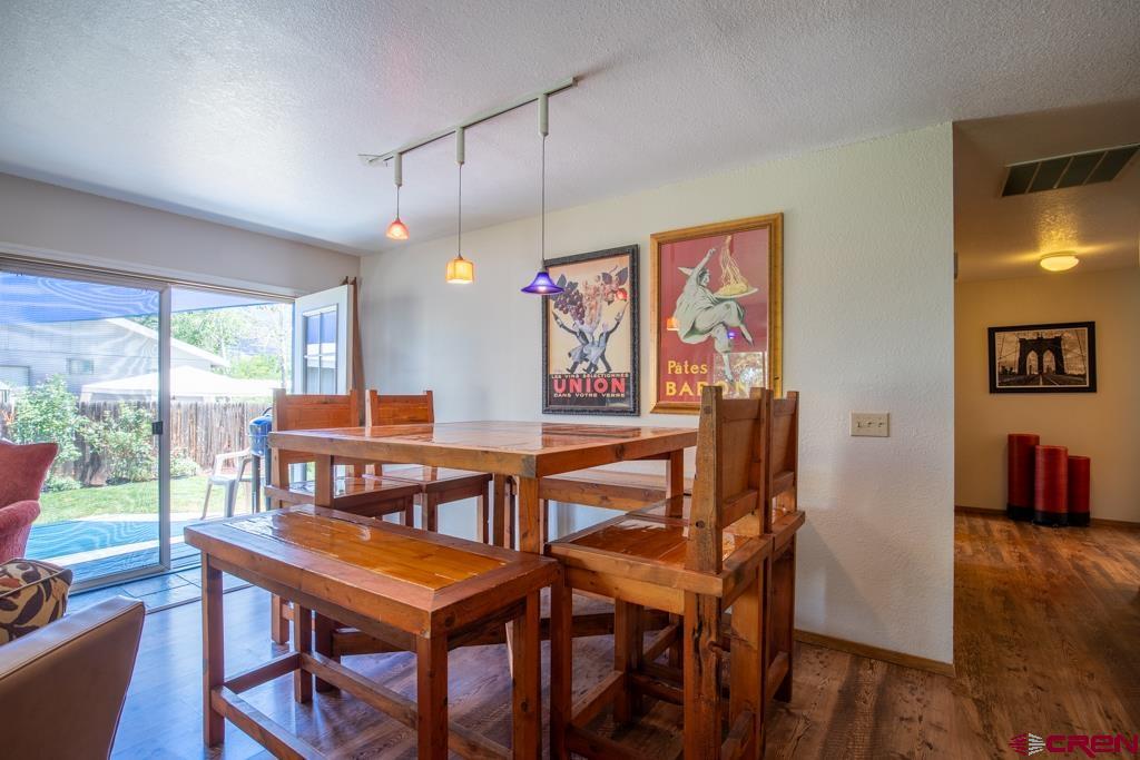 128 Hermosa Circle Durango, CO 81301 - Photo 10 of 26 a view of a dining room with furniture window and wooden floor
