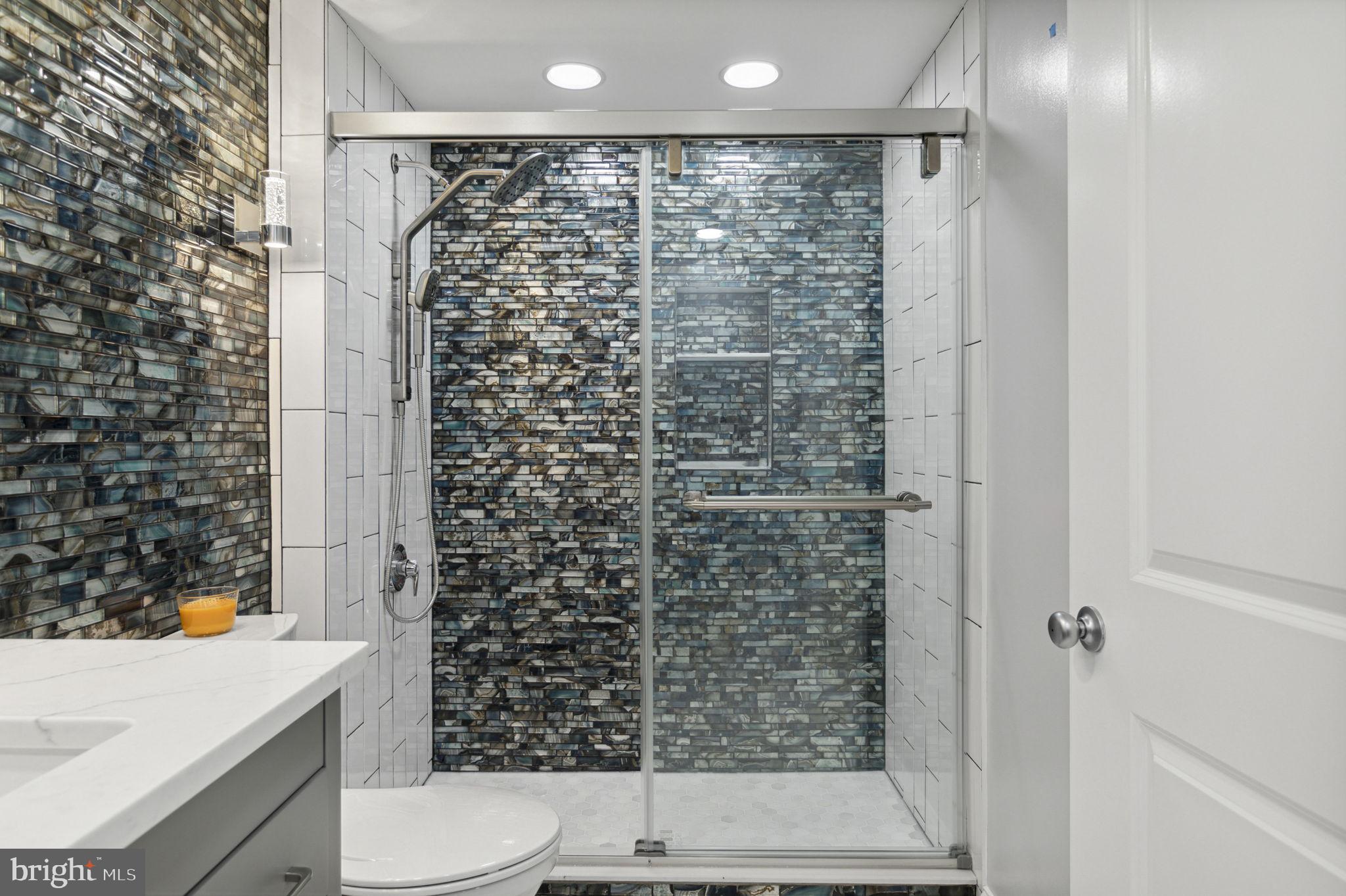 851 North Glebe Road, Unit 1404 Arlington, VA 22203 - Photo 30 of 62 a bathroom with a shower a toilet and a sink