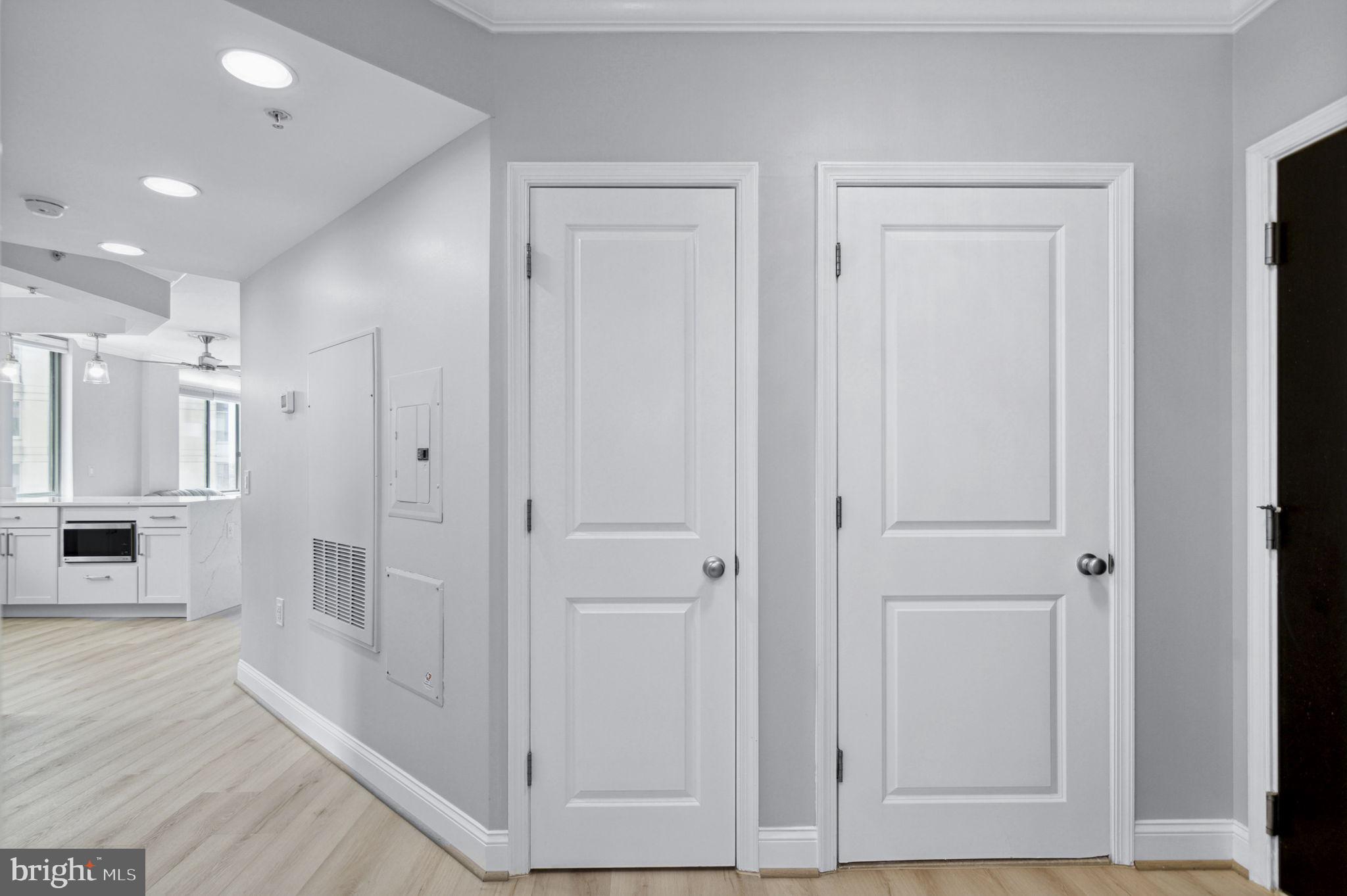 851 North Glebe Road, Unit 1404 Arlington, VA 22203 - Photo 34 of 62 a view of a hallway with white walls and cabinet