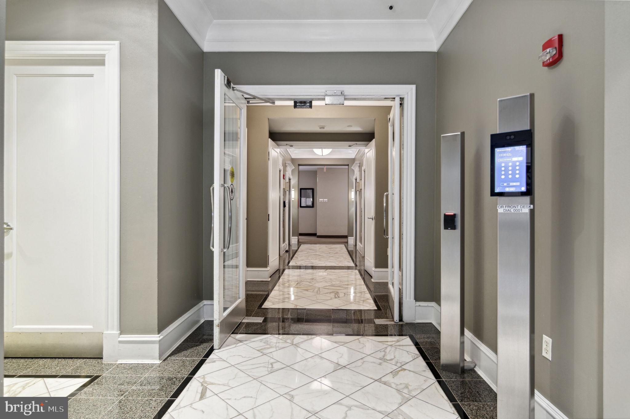 851 North Glebe Road, Unit 1404 Arlington, VA 22203 - Photo 39 of 62 a view of a hallway view with wooden floor and a living room
