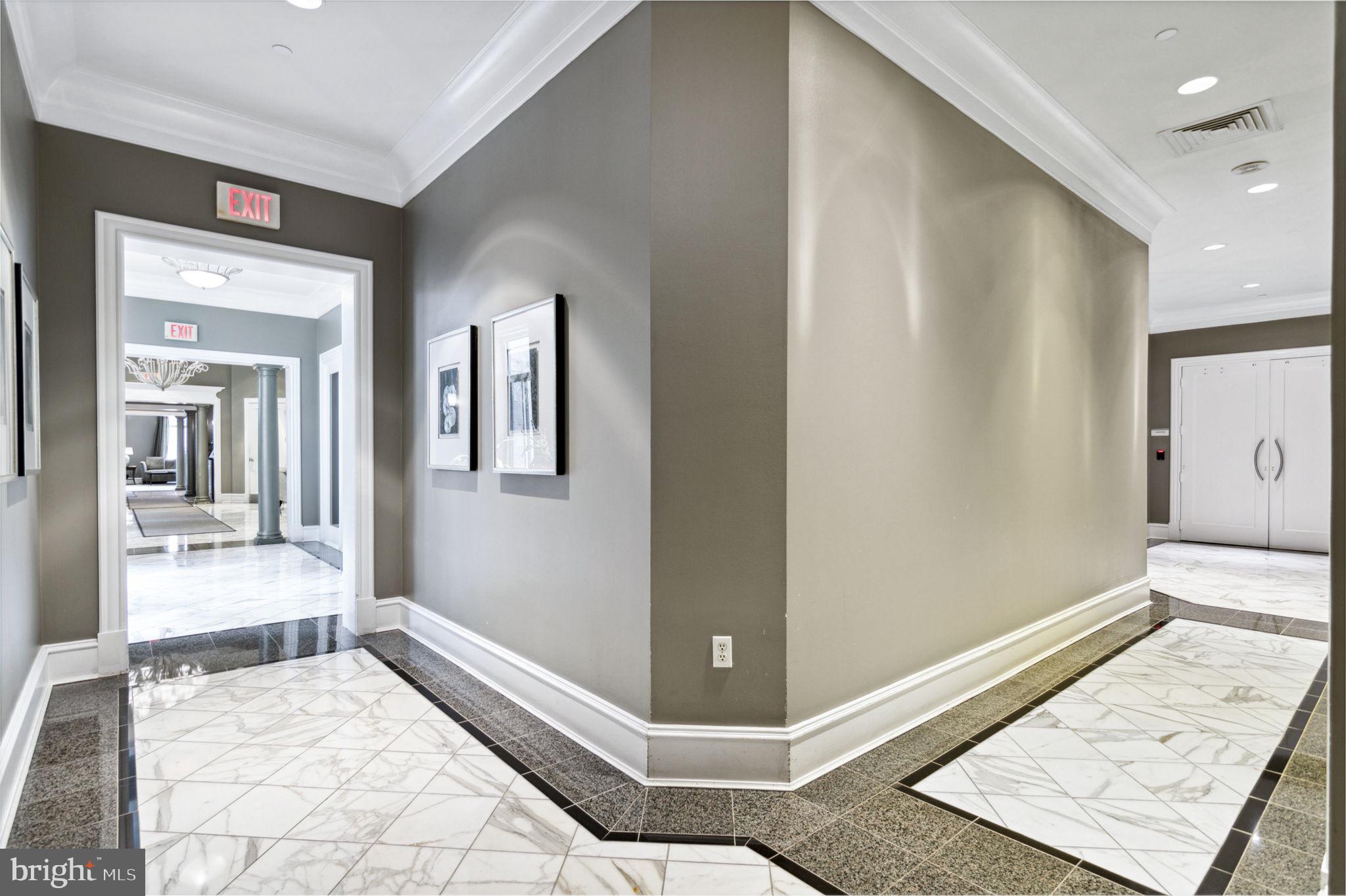 851 North Glebe Road, Unit 1404 Arlington, VA 22203 - Photo 41 of 62 a view of a hallway with a couch and a living room view