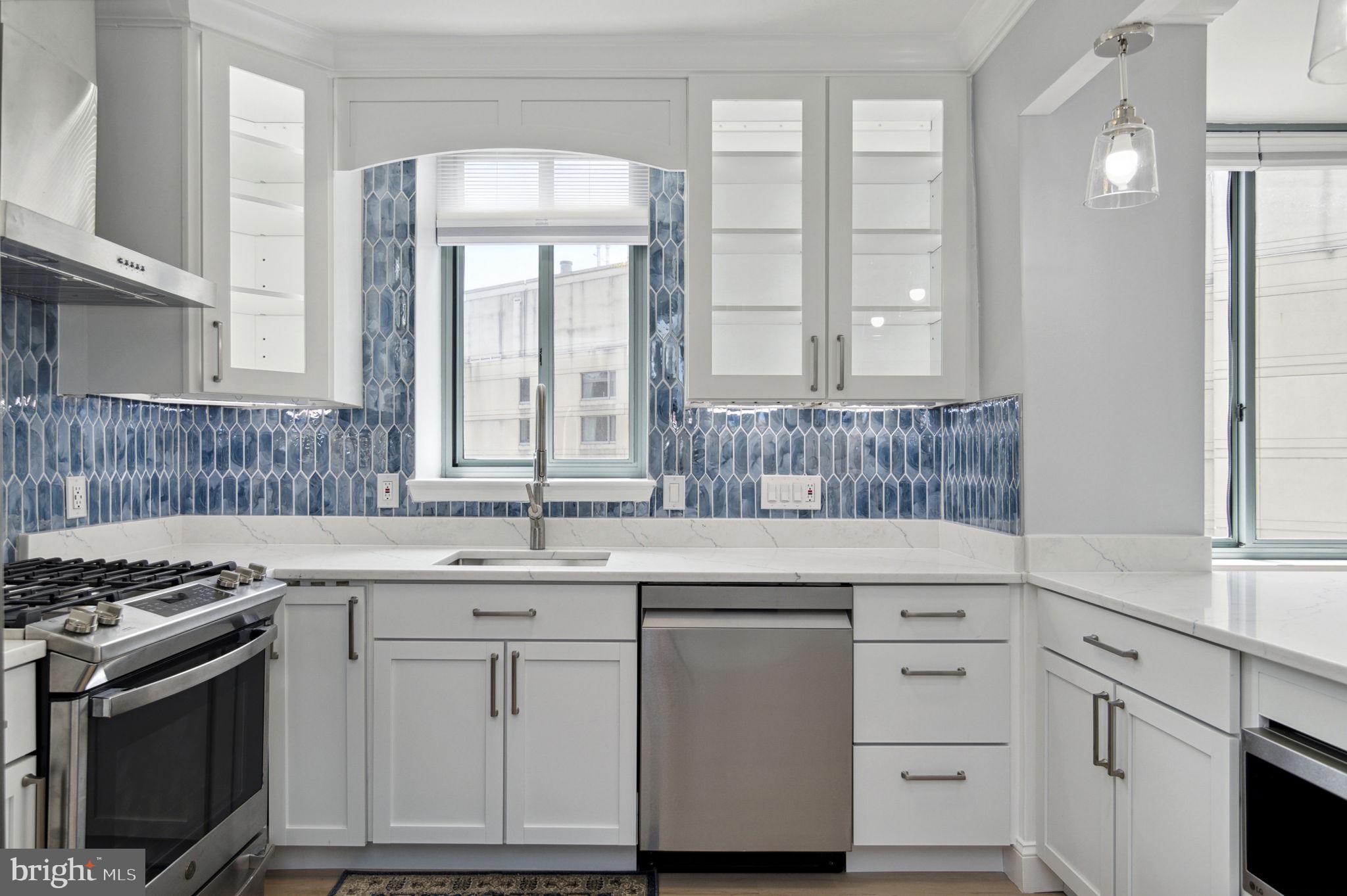 851 North Glebe Road, Unit 1404 Arlington, VA 22203 - Photo 8 of 62 a kitchen with cabinets appliances a sink and a window