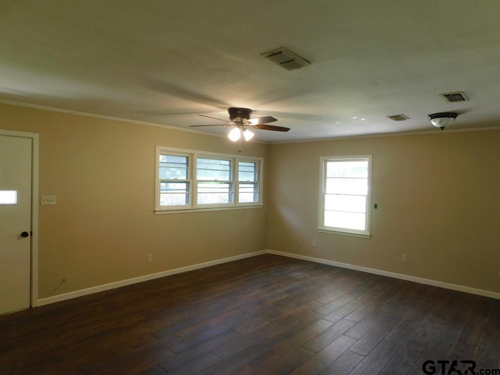 206 Mount Sylva Mount Lindale, TX 75771 - Photo 4 of 12 a view of an empty room with wooden floor and a window