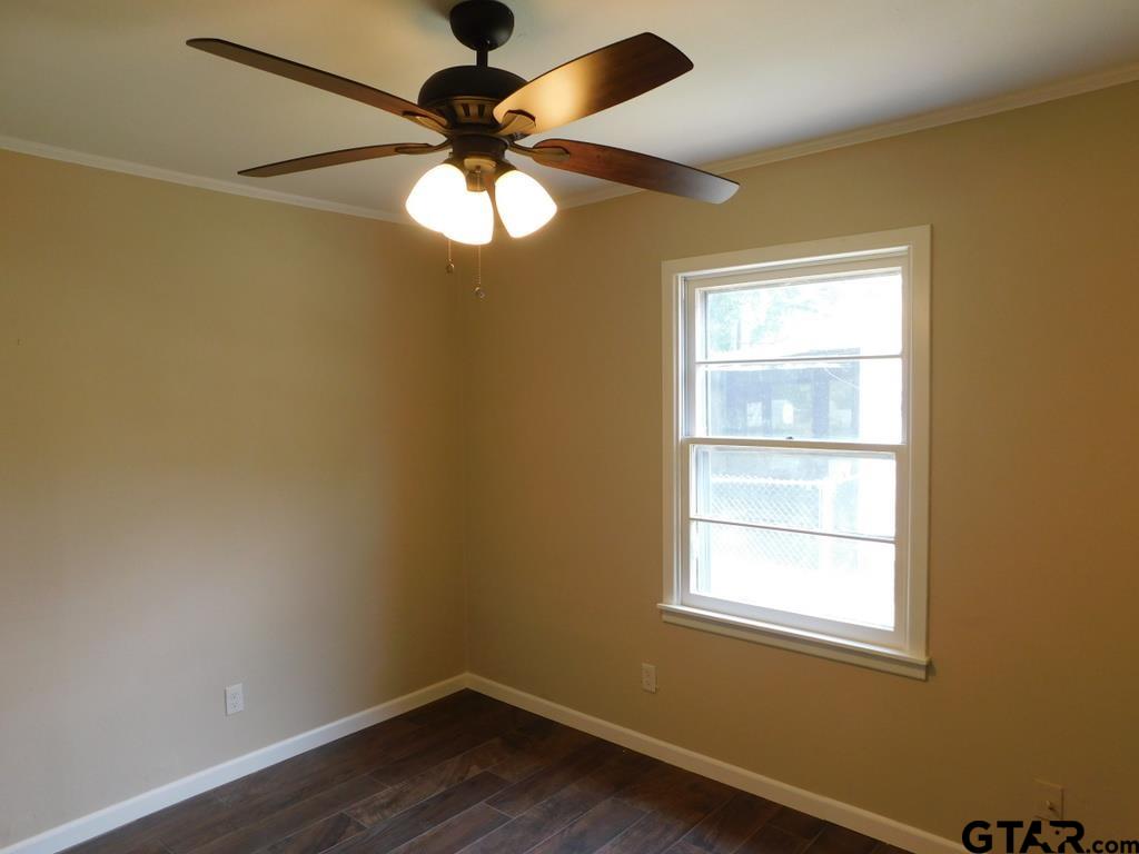 206 Mount Sylva Mount Lindale, TX 75771 - Photo 6 of 12 an empty room with a window and a fan