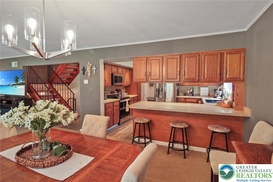 3470 Brodhead Road Bethlehem, PA 18020 - Photo 41 of 84 An open concept design seamlessly connects the dining area to a well-appointed kitchen.