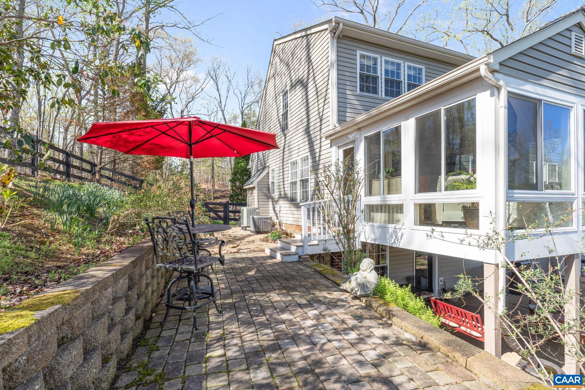 10 Mechunk Terrace Palmyra, VA 22963 - Photo 17 of 62 a view of a patio with a table and chairs under an umbrella