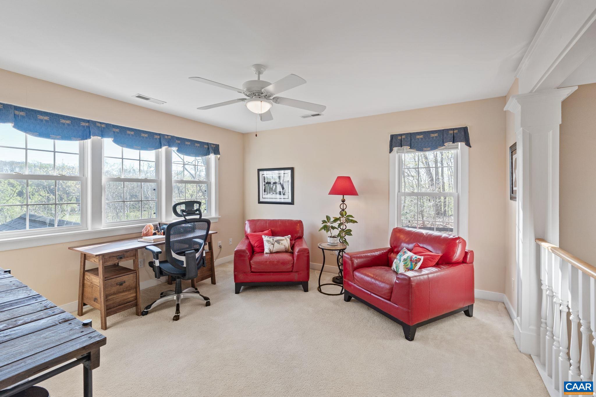 10 Mechunk Terrace Palmyra, VA 22963 - Photo 38 of 62 a living room with furniture and a floor to ceiling window