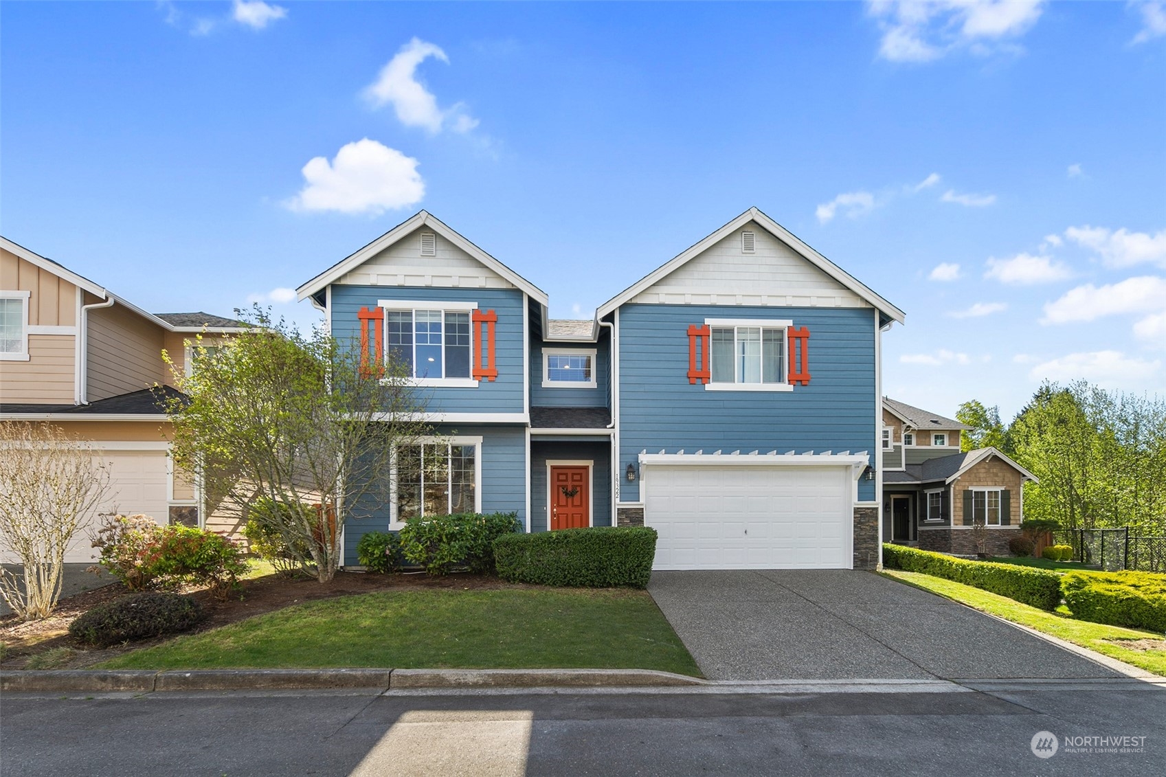 19322 6th Drive Southeast Bothell, WA 98012 - Photo 1 of 1 a front view of a house with a yard and garage