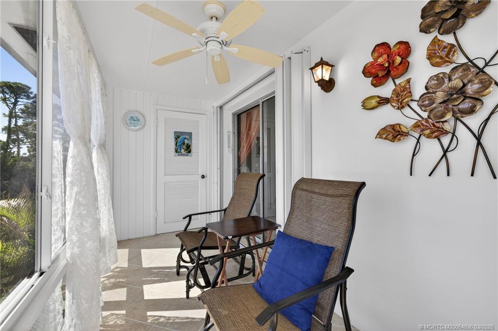1225 Northwest 21st Street, Unit 1810 Stuart, FL 34994 - Photo 19 of 48 a view of a dining room with furniture and a window