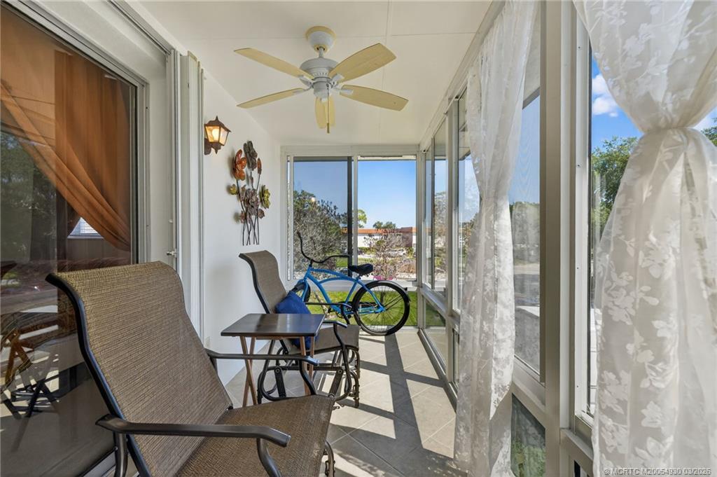 1225 Northwest 21st Street, Unit 1810 Stuart, FL 34994 - Photo 21 of 48 a view of a dining room with furniture and a window