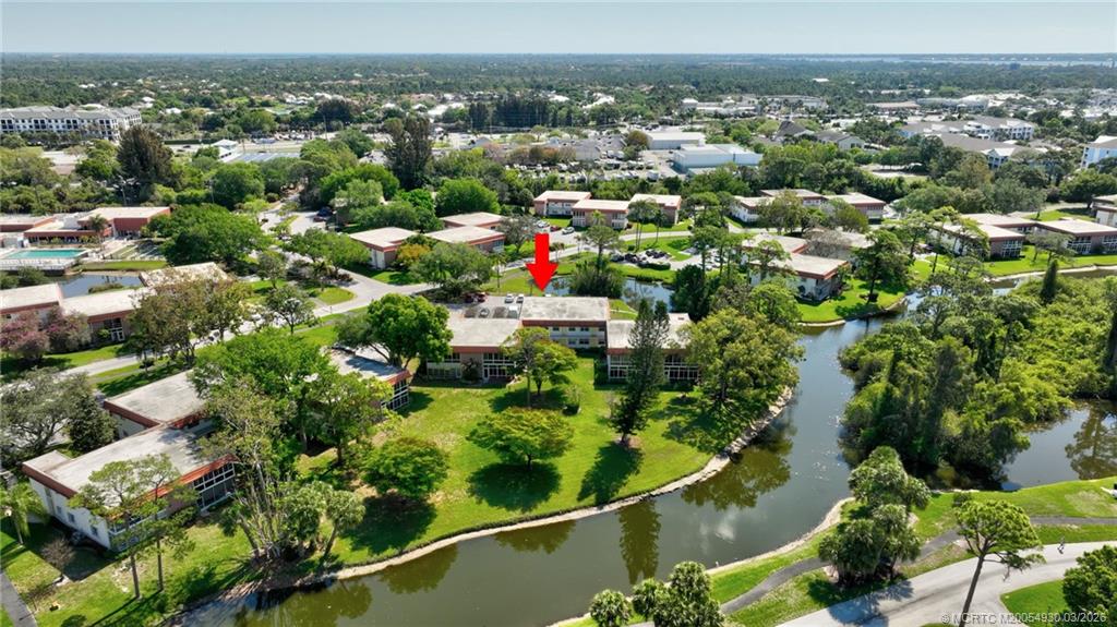 1225 Northwest 21st Street, Unit 1810 Stuart, FL 34994 - Photo 32 of 48 an aerial view of multiple house