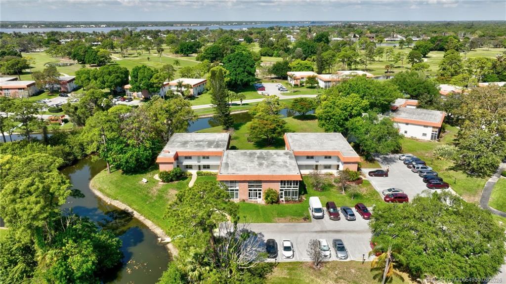 1225 Northwest 21st Street, Unit 1810 Stuart, FL 34994 - Photo 33 of 48 an aerial view of residential houses with outdoor space