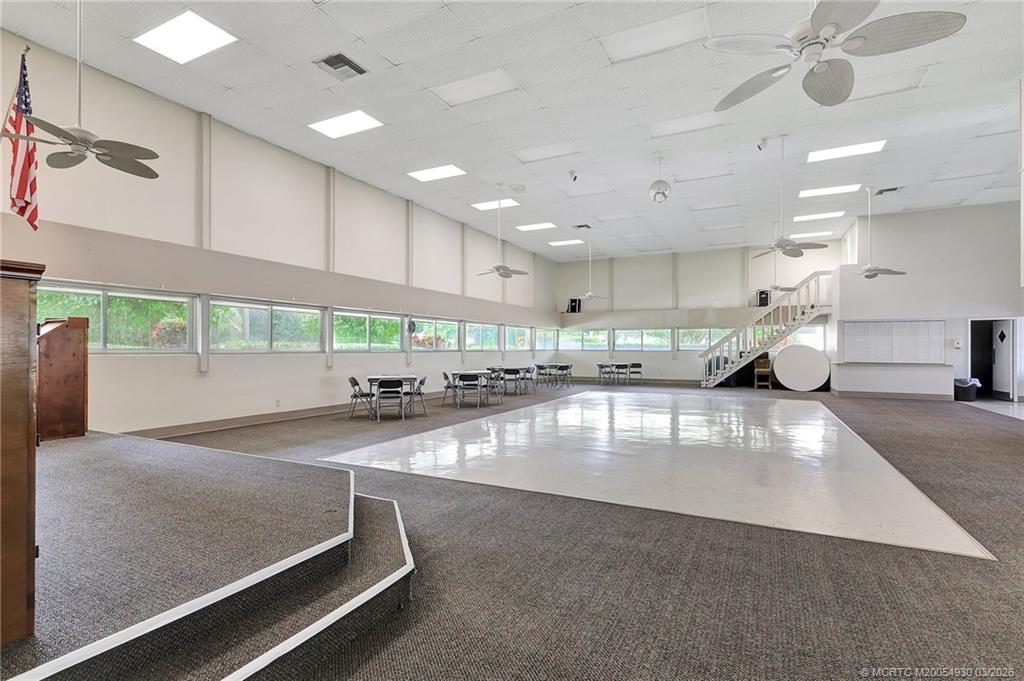 1225 Northwest 21st Street, Unit 1810 Stuart, FL 34994 - Photo 43 of 48 a large room with gym equipment