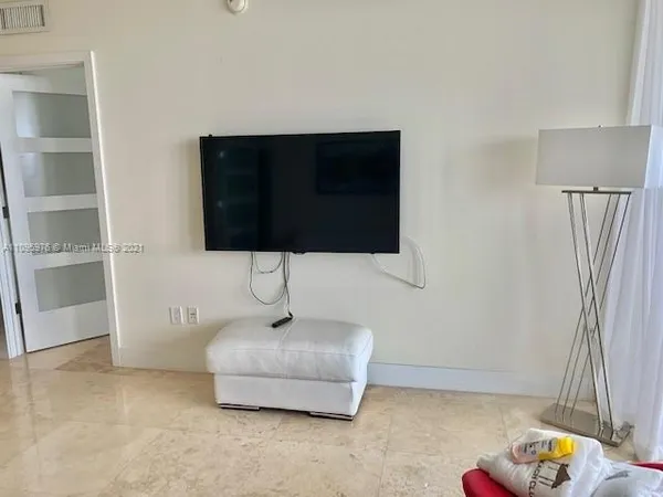 a room with a sink and a mirror