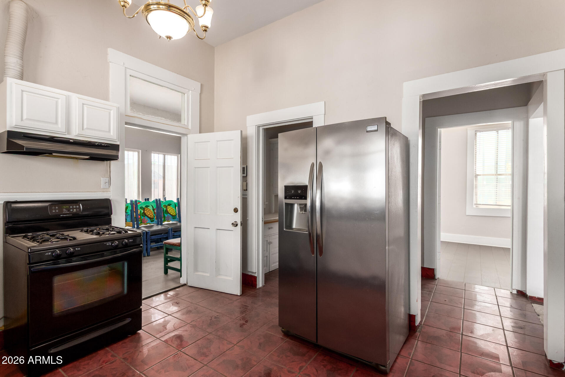 819 South 3rd Avenue Phoenix, AZ 85003 - Photo 13 of 45 a kitchen with stainless steel appliances granite countertop a refrigerator a stove and a sink with granite countertops