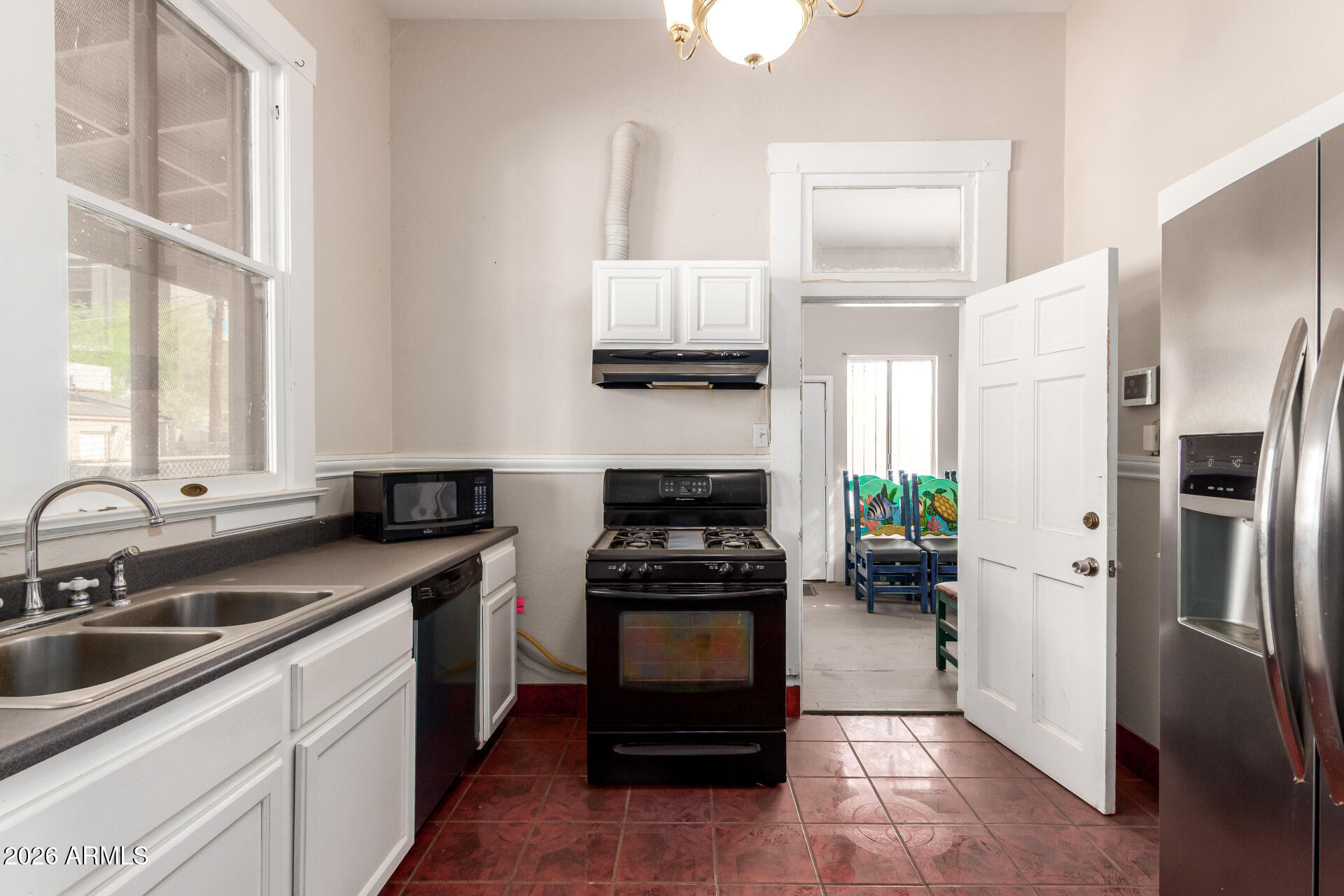 819 South 3rd Avenue Phoenix, AZ 85003 - Photo 15 of 45 a kitchen with a refrigerator and a sink