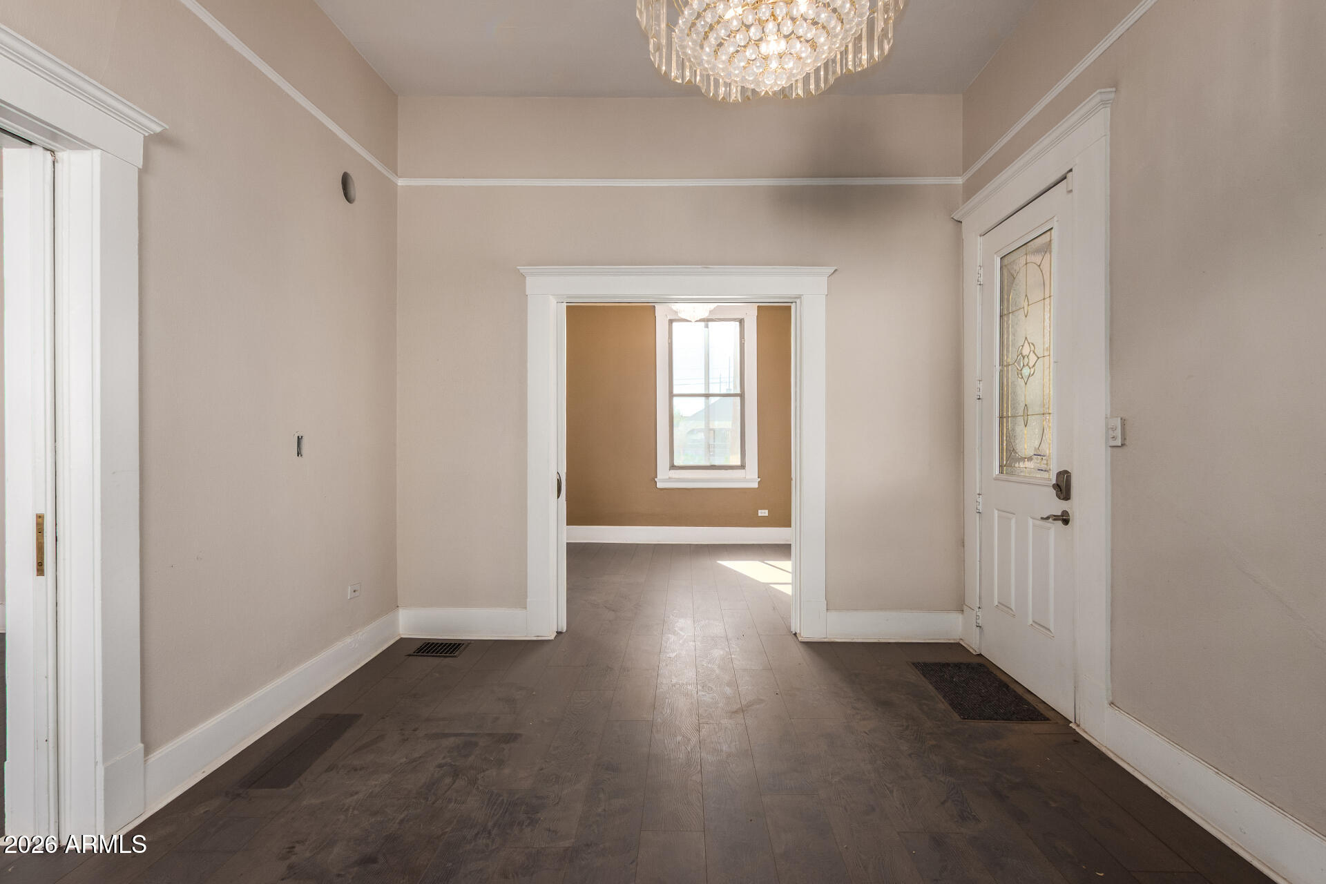 819 South 3rd Avenue Phoenix, AZ 85003 - Photo 21 of 45 an empty room with wooden floor and windows