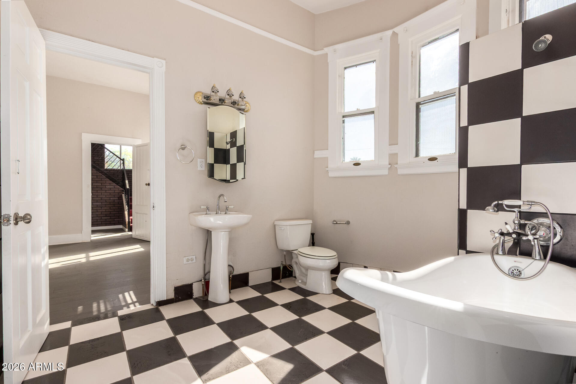 819 South 3rd Avenue Phoenix, AZ 85003 - Photo 23 of 45 a bathroom with a sink a toilet and a mirror