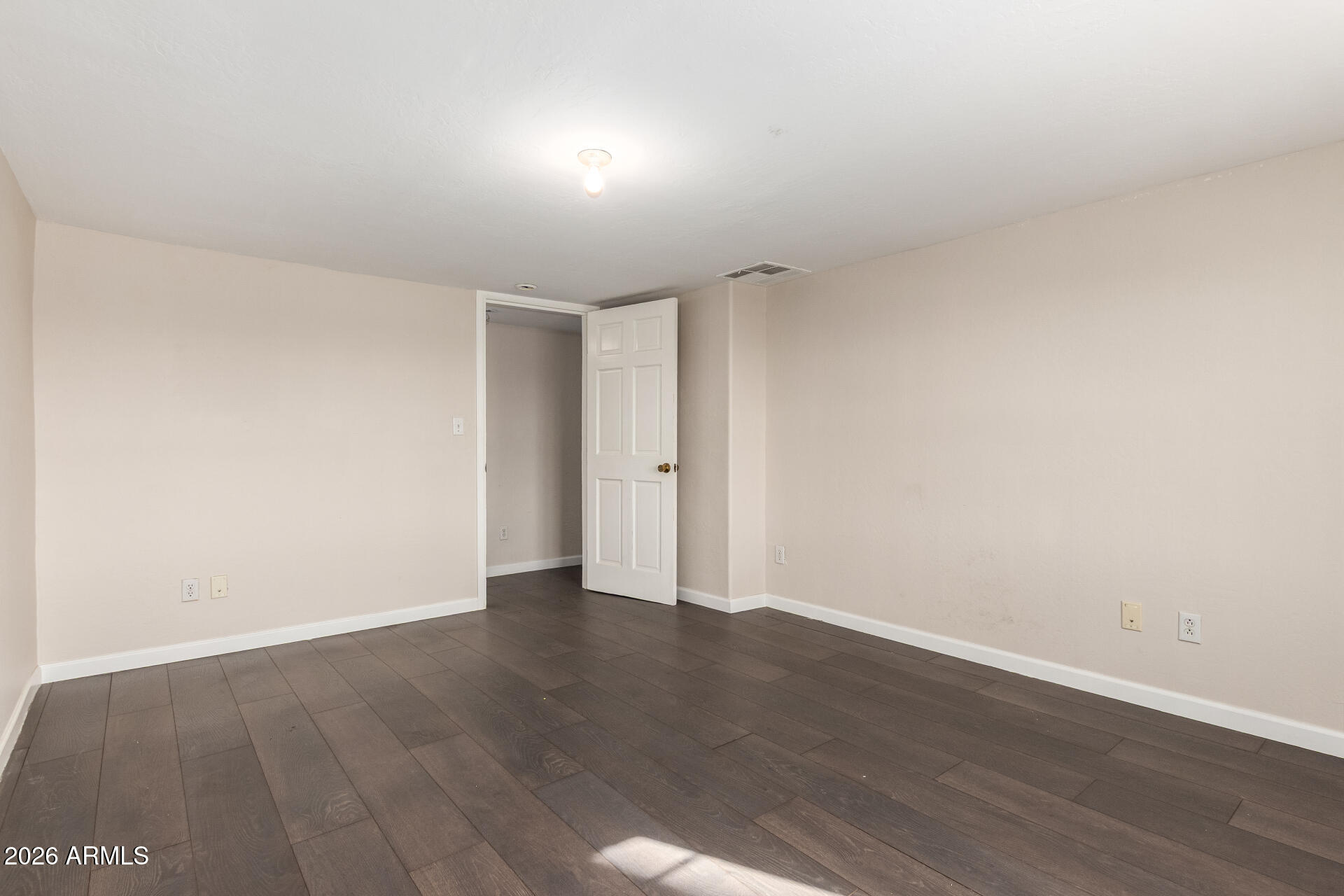 819 South 3rd Avenue Phoenix, AZ 85003 - Photo 25 of 45 a view of an empty room with wooden floor