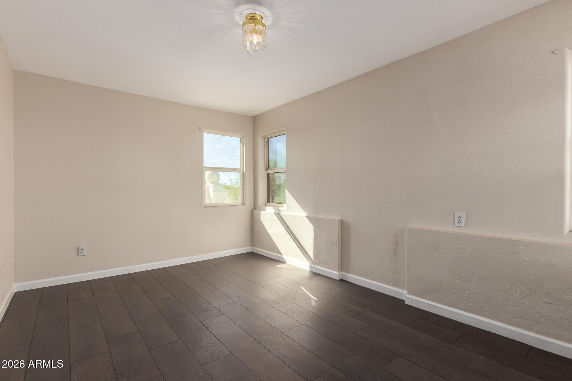 819 South 3rd Avenue Phoenix, AZ 85003 - Photo 28 of 45 an empty room with wooden floor and windows