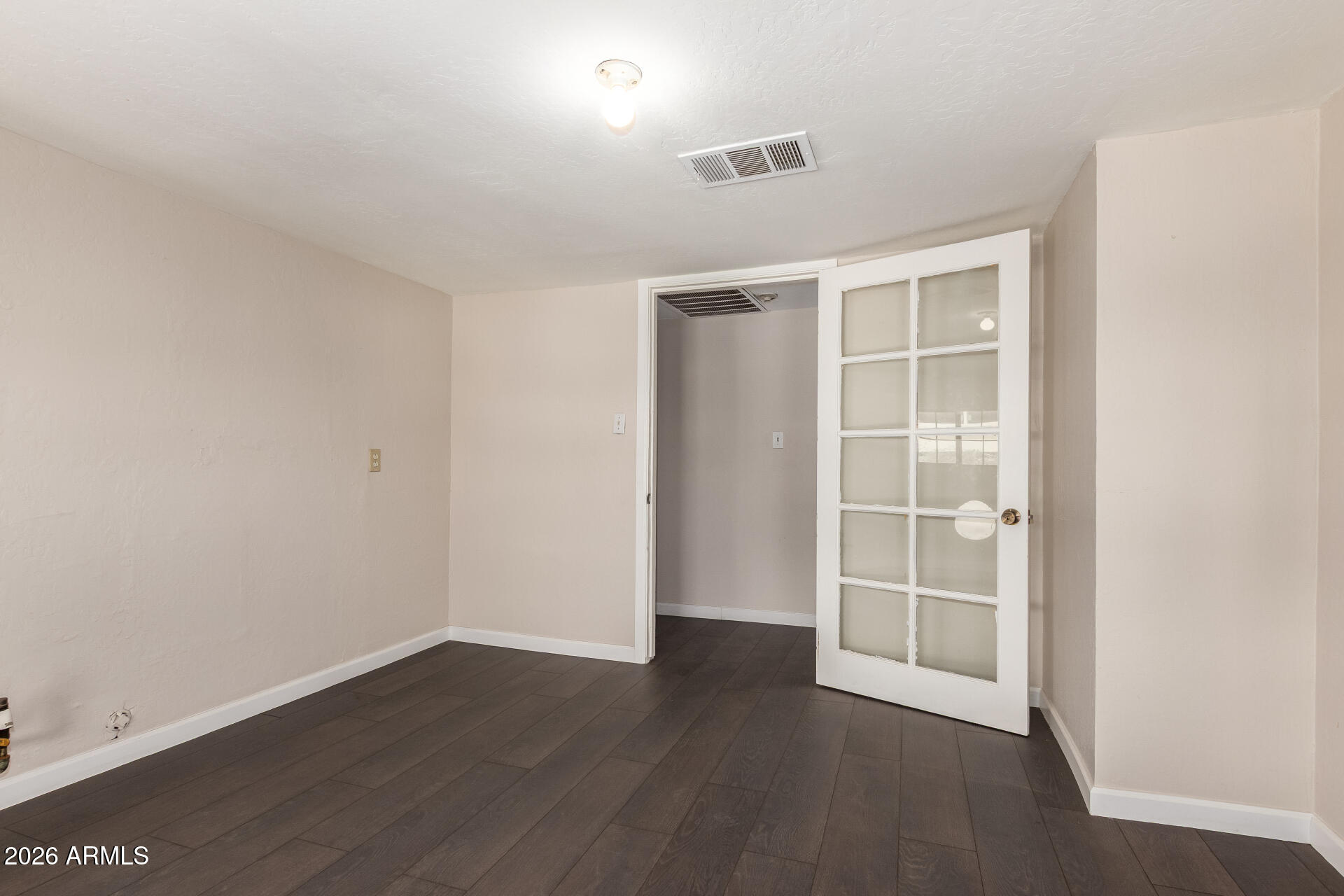 819 South 3rd Avenue Phoenix, AZ 85003 - Photo 33 of 45 an empty room with wooden floor and windows