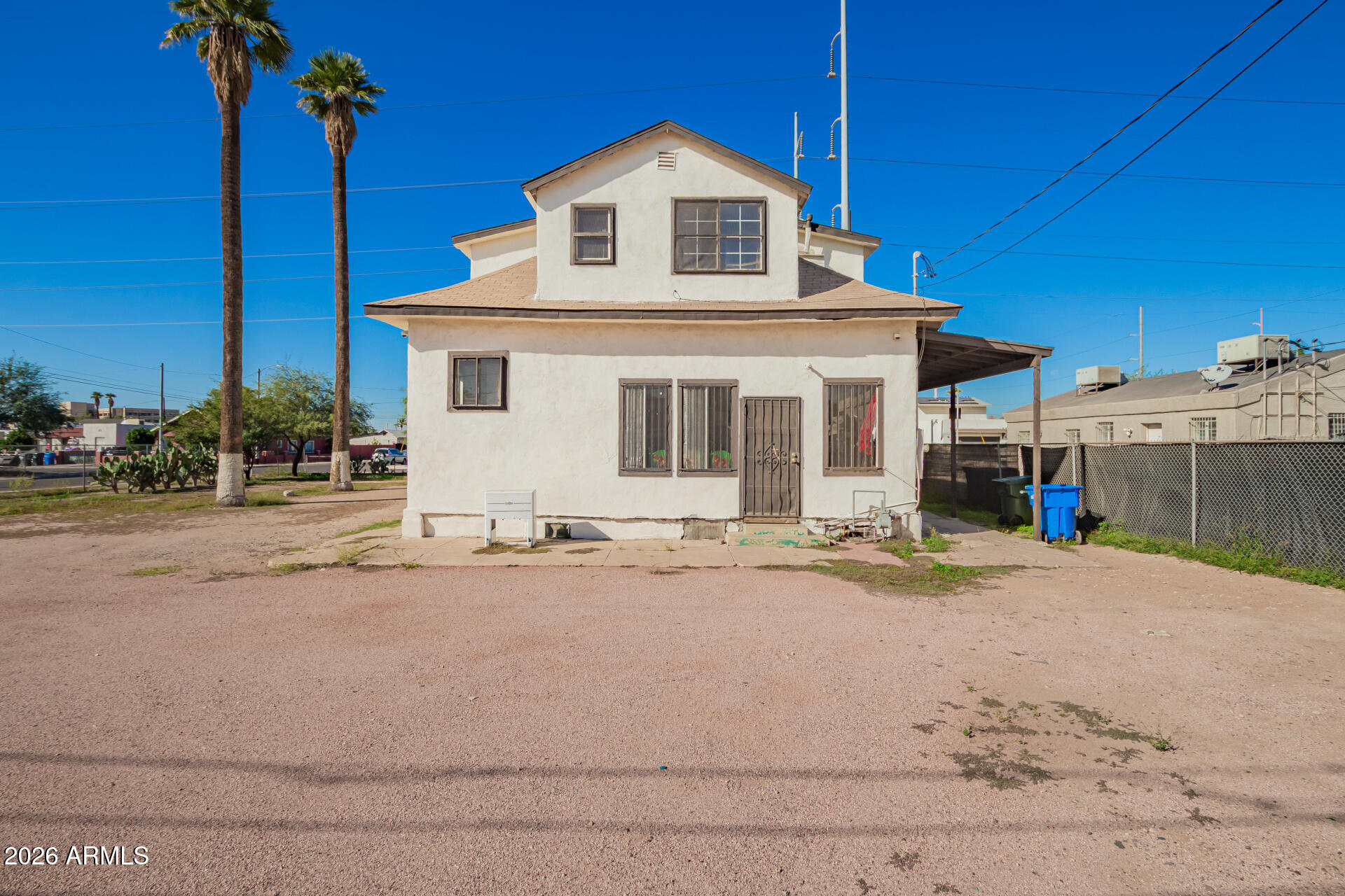 819 South 3rd Avenue Phoenix, AZ 85003 - Photo 43 of 45 a front view of a house with a yard and garage