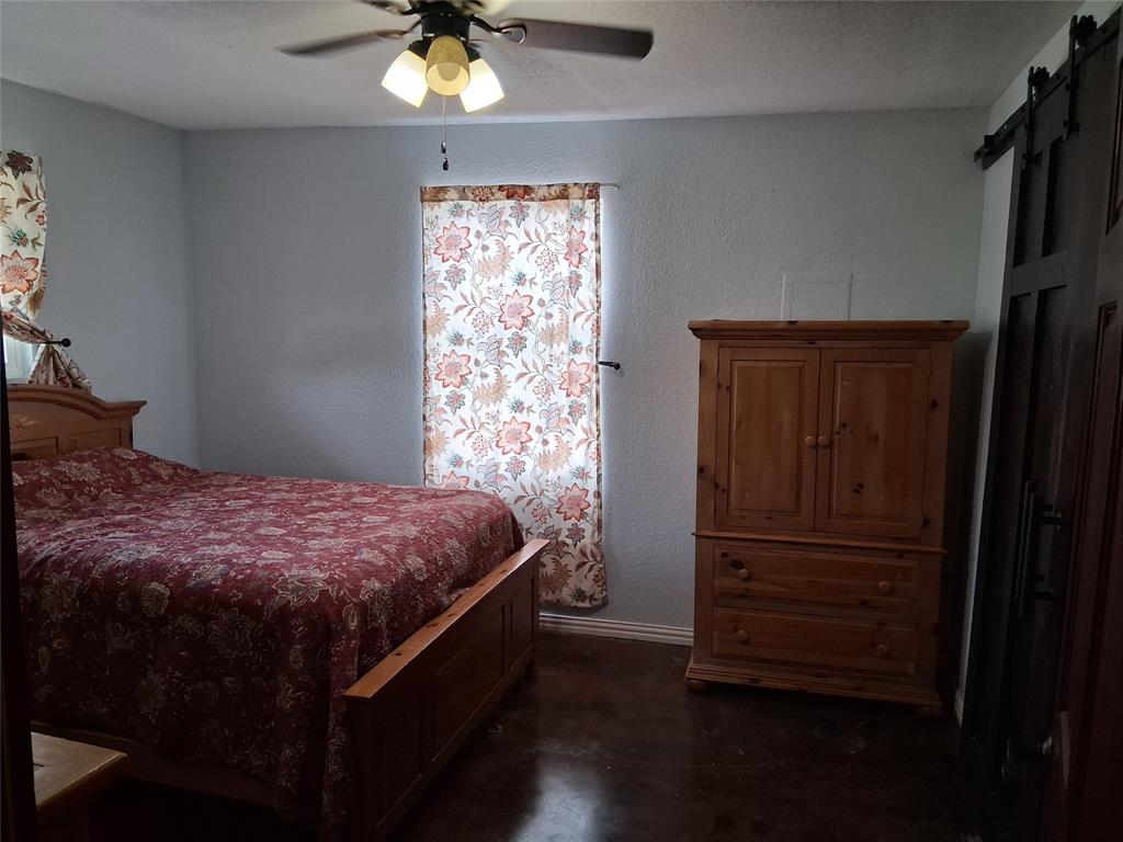 1584 Kelly Road, Unit B Aledo, TX 76008 - Photo 13 of 24 a bedroom with a bed and a window