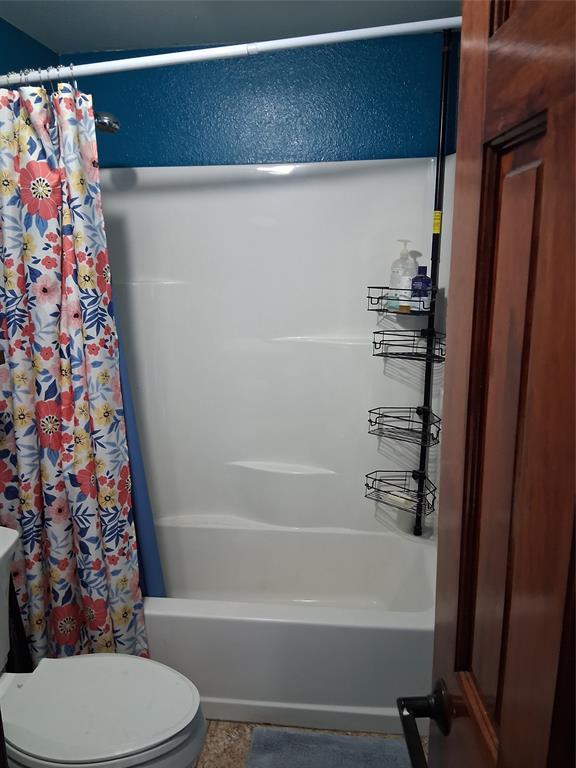 1584 Kelly Road, Unit B Aledo, TX 76008 - Photo 14 of 24 a bathroom with a bathtub and toilet