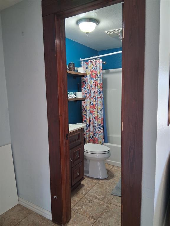 1584 Kelly Road, Unit B Aledo, TX 76008 - Photo 15 of 24 a bathroom with a toilet and a shower