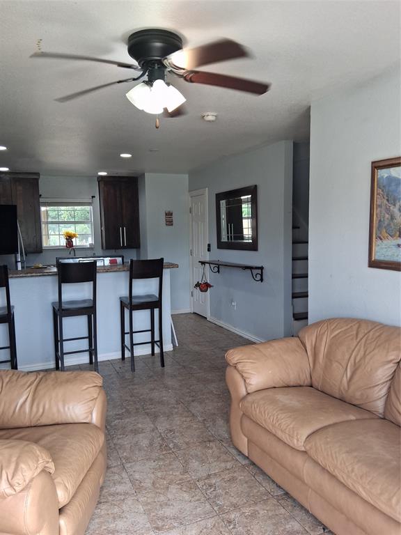 1584 Kelly Road, Unit B Aledo, TX 76008 - Photo 2 of 24 a living room with furniture and a flat screen tv