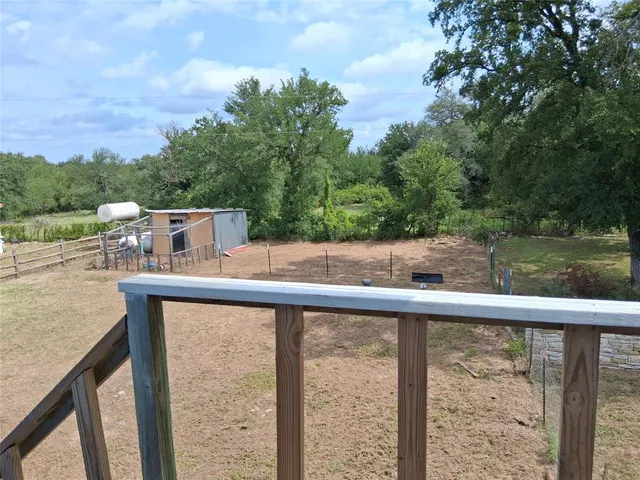 a view of a balcony with an outdoor space