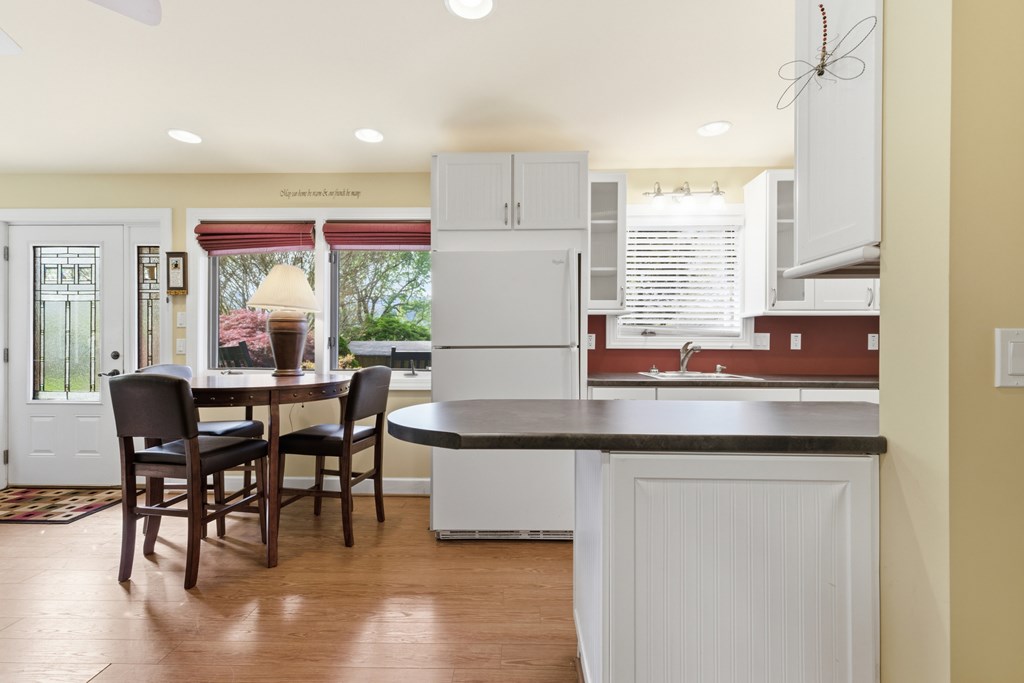 6203 Airport Road Andrews, NC 28901 - Photo 23 of 50 a kitchen with a table chairs and a window