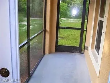 a view of a room with a large window