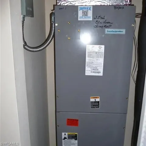 a white toilet sitting next to a bath tub