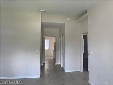 a view of an empty room with a window