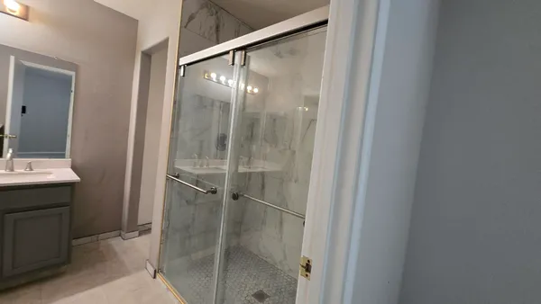 a kitchen with a sink stove and microwave