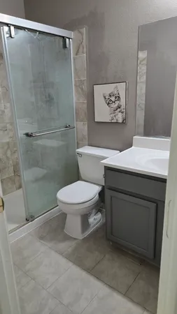 a bathroom with a mirror a sink and a mirror