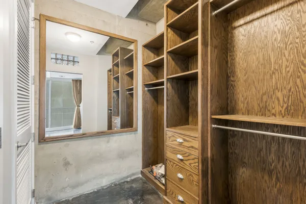 a view of walk in closet with empty space