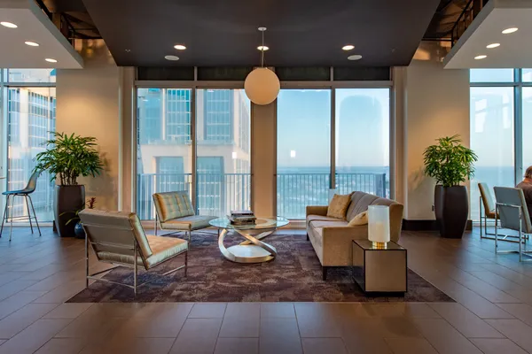 a living room with furniture and a large window