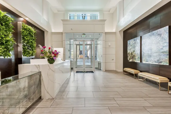 a view of an entryway with wooden floor and door