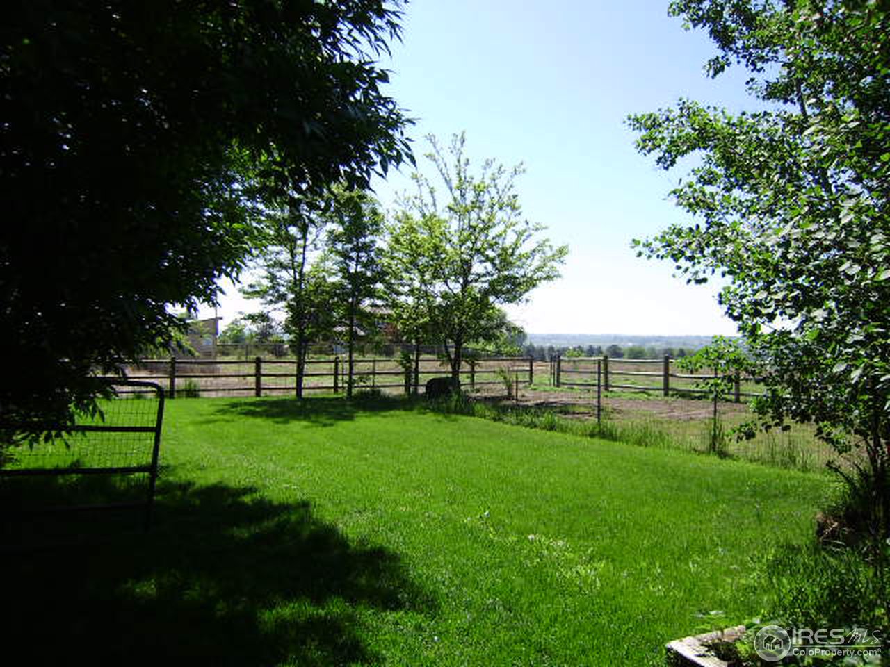 9568 Phillips Road Lafayette, CO 80026 - Photo 17 of 18 a view of a backyard with large trees