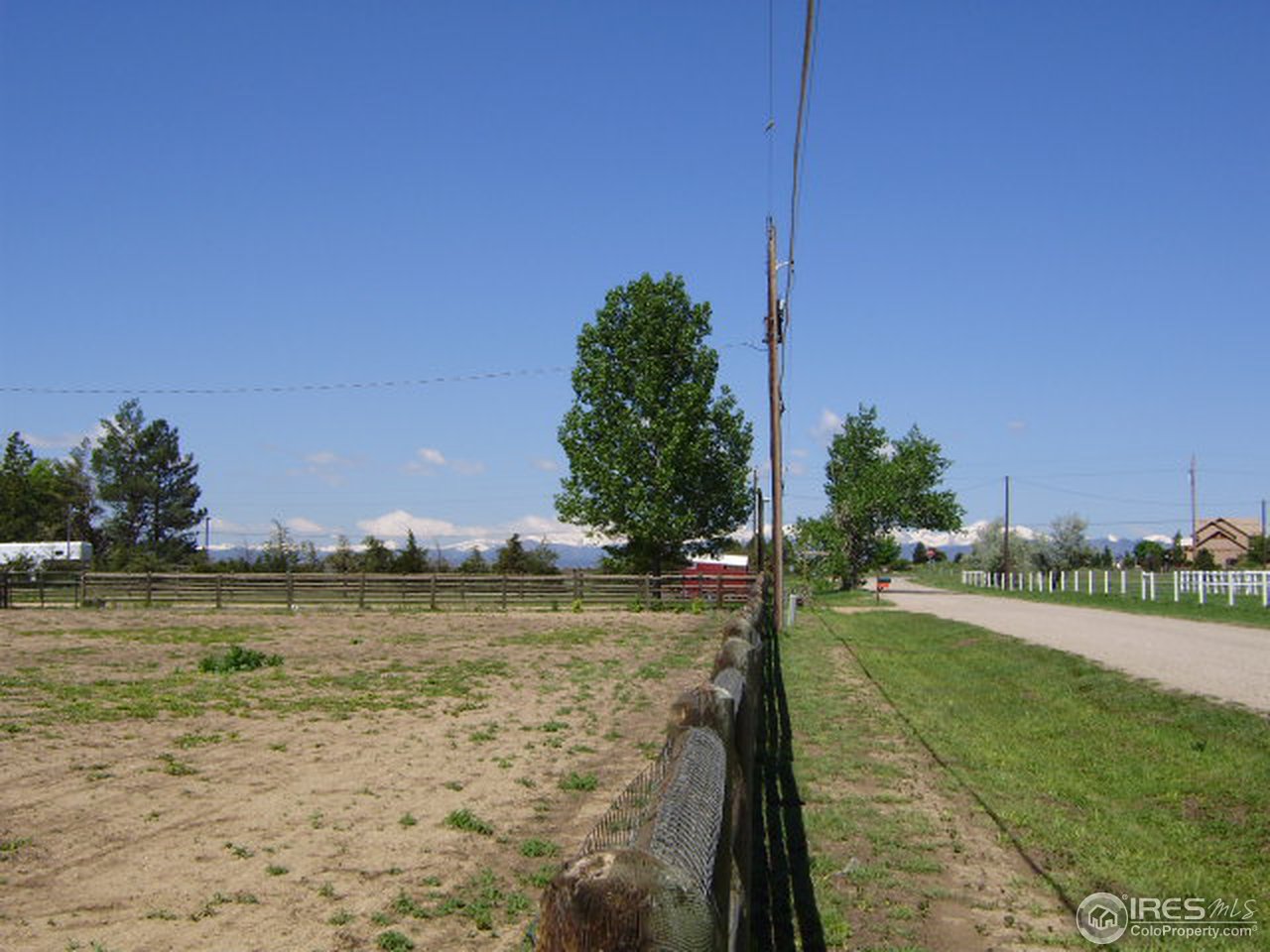 9568 Phillips Road Lafayette, CO 80026 - Photo 18 of 18 a view of a lake with houses in the background