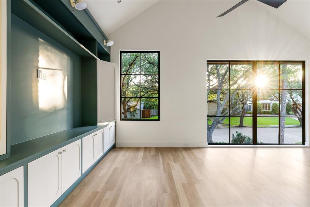 3944 Dalgreen Drive Dallas, TX 75214 - Photo 27 of 38 a view of an empty room with wooden floor and a window