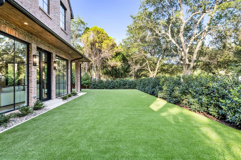3944 Dalgreen Drive Dallas, TX 75214 - Photo 32 of 38 a view of a house with a backyard porch and garden